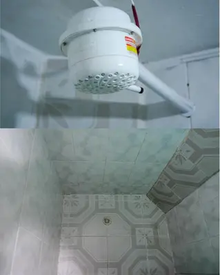a light hanging from a ceiling in a room at Apto Acogedor Cerca Metrocable in Medellín