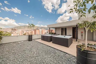 an outdoor patio with a view of a building at Quadrato Studios in Medellín