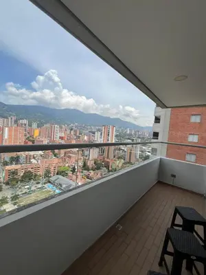 a balcony with a view of a city at Apartamento moderno y acogedor en el corazón de Sabaneta in Sabaneta