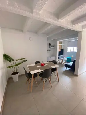 a dining room with a table and chairs at Lindo Apartamento Amoblado en buen sector en Sabaneta in Sabaneta