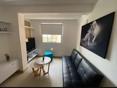 a living room with a couch and a table at Lindo Apartamento Amoblado en buen sector en Sabaneta in Sabaneta