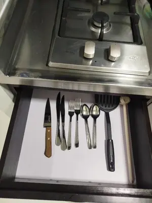 a group of utensils on a counter next to a stove at Apartamento en Belén in Medellín