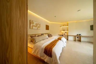 a bedroom with a large bed in a room at Moabi Hotel in Medellín