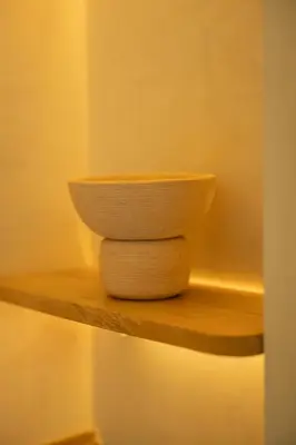 a bowl sitting on a shelf in a room at Moabi Hotel in Medellín