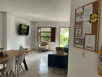 a living room with a table and a dining room at Majana 1 in Jardin