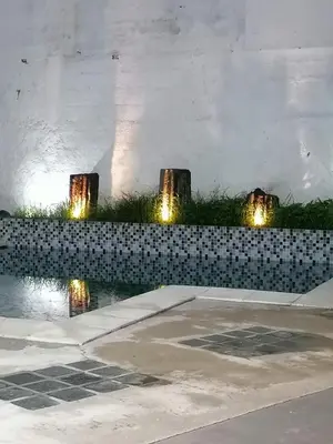 a group of lights on the side of a wall at Casa del Cable in Mariquita
