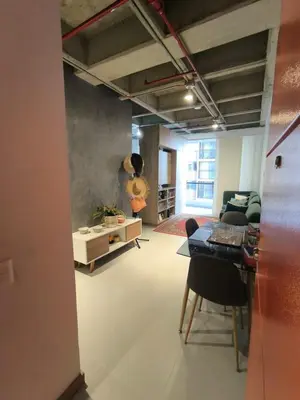 a living room with a couch and a table in a room at Incleible Apartamento en Sabaneta in Sabaneta