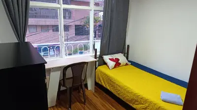 a room with a desk and a bed and a window at Residencias Universitarias La Casa de Lu sede Estrella in Manizales