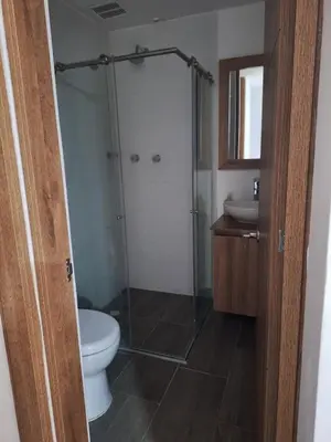 a bathroom with a shower and a toilet and a sink at Apartment FL101 in Manizales