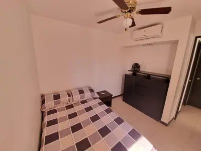 a bedroom with a bed and a ceiling fan at Apartasol Familiar 2 in Santa Fe de Antioquia