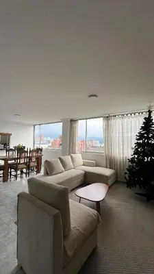 a living room with a christmas tree and a couch at Apartamento 3 habitaciones 2 baños Vista Panoramica - Av Santander Sector El Cable y Estadio Palogrande in Manizales