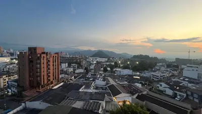 a view of a city at sunset at Apartamento 3 habitaciones 2 baños Vista Panoramica - Av Santander Sector El Cable y Estadio Palogrande in Manizales