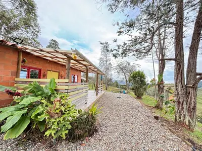 a house with a pathway next to a building at Villa Manantiales con baño turco y Jaquzzi in Carolina del Principe