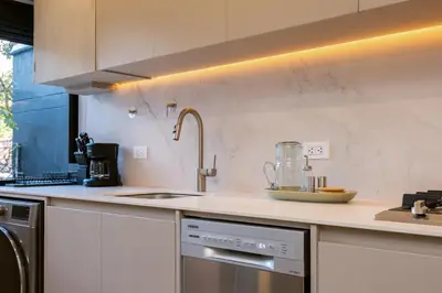 a kitchen with a counter with a blender on it at StrataSix Hotel in Medellín