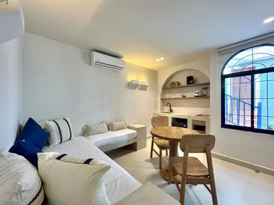 a living room with a couch and a table at Villa kalah in Puerto Triunfo