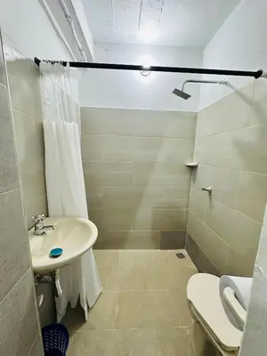 a bathroom with a sink and a shower at Santorini Colombiano in Puerto Triunfo