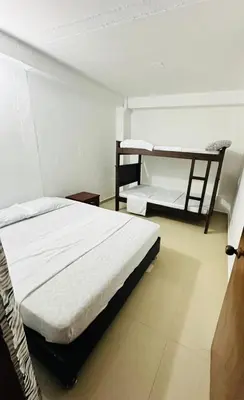 a bedroom with two bunk beds in a room at Santorini Colombiano in Puerto Triunfo