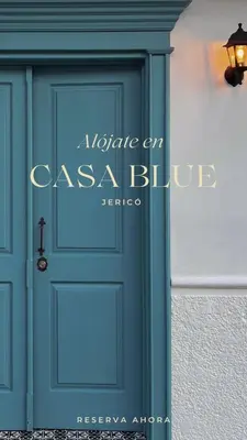 a blue door with a sign that reads inside an occult club at Casa Blue Jericó in Jericó