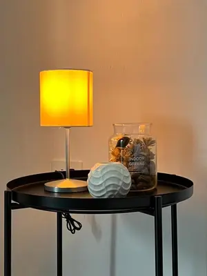a table with a lamp and a glass jar on it at Casa Blue Jericó in Jericó