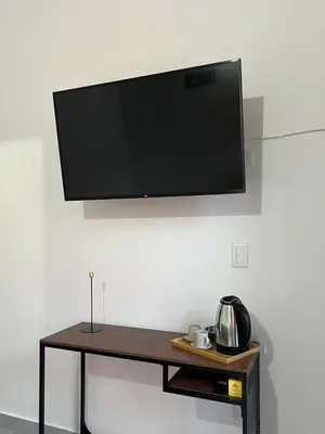 a flat screen tv hanging on a wall at Casa Blue Jericó in Jericó