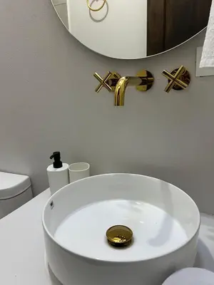 a white bathroom with a sink and a mirror at Casa Blue Jericó in Jericó
