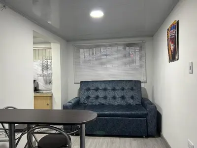 a living room with a couch and a table at Apartamento en Manizales in Manizales