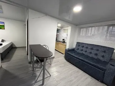 a living room with a couch and a table at Apartamento en Manizales in Manizales