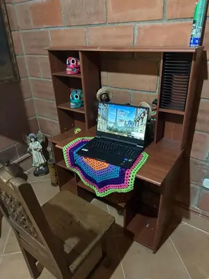 a desk with a laptop computer on top of it at Paraiso del Nomada in Barbosa