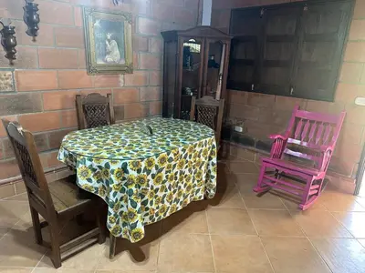 a table with two chairs and a table cloth at Paraiso del Nomada in Barbosa