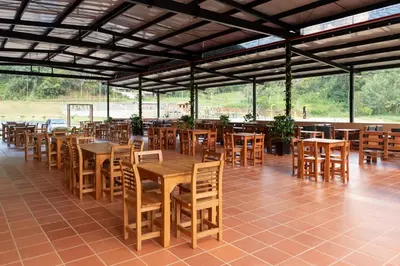 a dining room with wooden tables and chairs at Santa María del Río in San Rafael