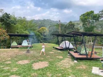 a little girl walking through a park with three benches at Santa María del Río in San Rafael
