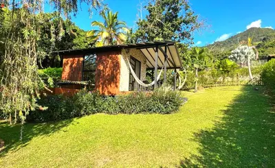 a small building in a yard with a green lawn at Chalets Villa Marina in Copacabana