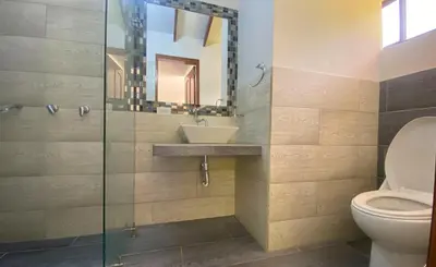 a bathroom with a sink and a toilet at Chalets Villa Marina in Copacabana