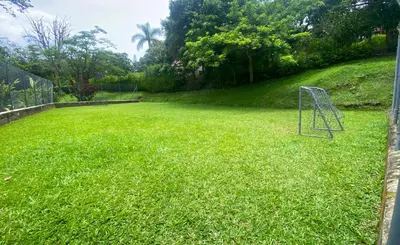 a yard with a soccer goal in the grass at Chalets Villa Marina in Copacabana