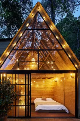 a gazebo with a bed in it with lights at Onirico Refugio in Medellín