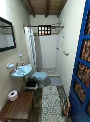 a bathroom with a toilet and a sink at Cabaña G203 in Girardota