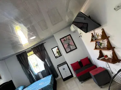 an overhead view of a living room with a red couch at Habitación la esmeralda in Puerto Triunfo