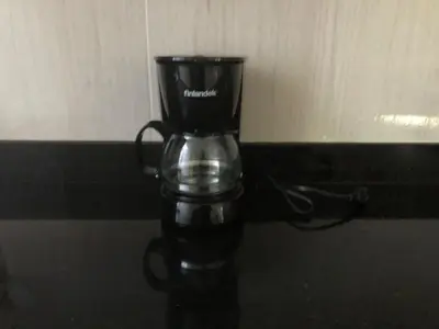 a coffee pot sitting on top of a table at Magnífico apto para disfrutar su estadia in Medellín
