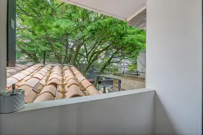 a view from a window of a roof at CUMBIANA - Apt with Hot Tub on Provenza's Main Street in Medellín