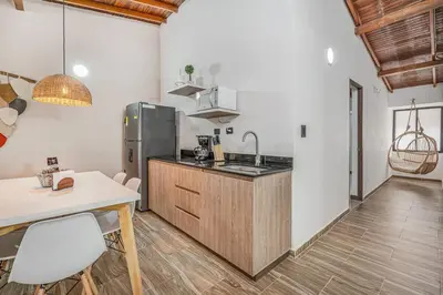 a kitchen with a sink and a counter top at CUMBIANA - Apt with Hot Tub on Provenza's Main Street in Medellín