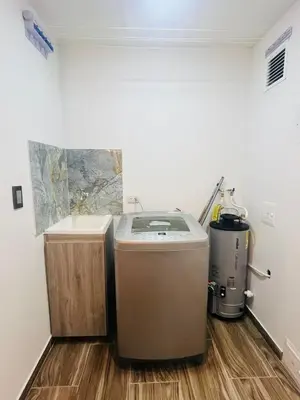 a washer and dryer in a room with a floor at Apto - Vista Única en Manizales in Manizales