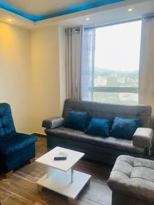 a living room with a couch and a table at Apto - Vista Única en Manizales in Manizales