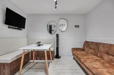 a living room with a couch and a table at GAIRA - Provenza Walkable Area, AC & Balcony facing KarolG club in Medellín