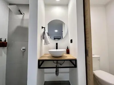 a bathroom with a sink and a mirror at FIJI - Jacuzzi & Outdoor Lounge in Provenza in Medellín
