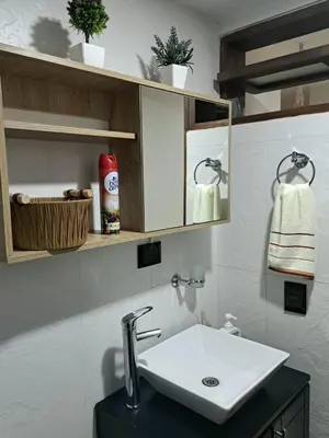 a bathroom with a white sink and a counter at Apartamento entero cerca al Aeropuerto Internacional in Rionegro