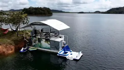 a small boat is docked on a lake at El Ismael de Jaguas in San Rafael