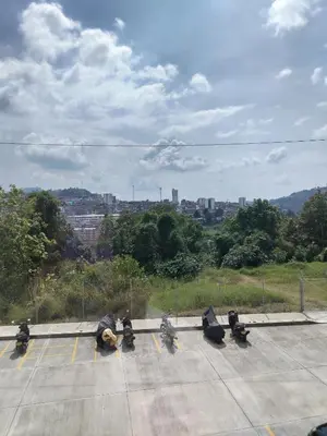 a group of motorcycles parked in a parking lot at Apartamento en Manizales reserva campestre in Manizales