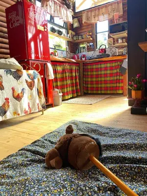 a teddy bear laying on a rug on the floor at Cabaña Caballo Dorado in Guarne