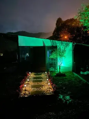 a building with lights in front of it at night at Chalet las palmas Poblado in Medellín