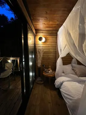 a bedroom with a canopy bed and a table at Onirico Luxury in Medellín